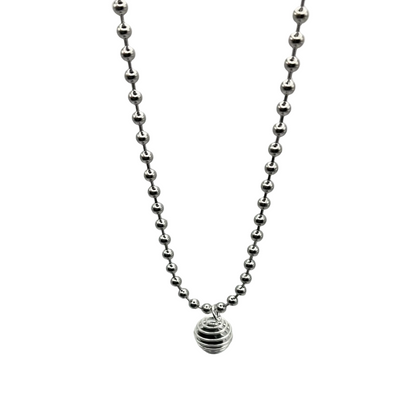 silver tone ball chain with black obsidian chip cage on grey background