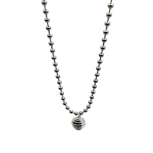 silver tone ball chain with black obsidian chip cage on grey background