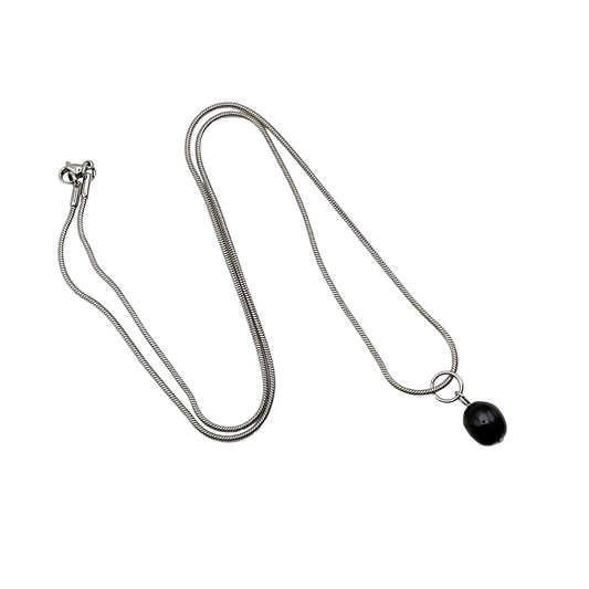 Silver tone necklace with a black pearl pendant on a white background