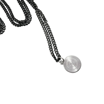 Reverse side of Black Pentacle Necklace on a white background