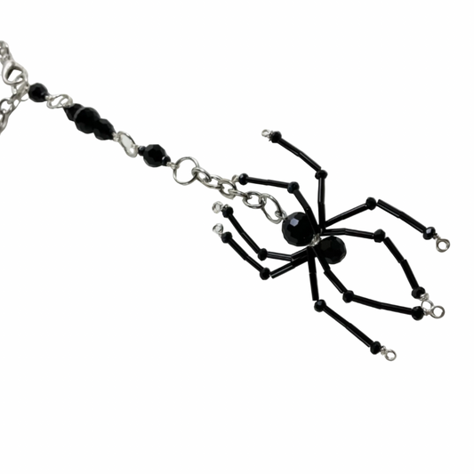 Black spider-shaped beaded Sun Catcher Car Charm on a chain against a white background