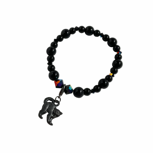 Black beaded bracelet with a cat charm on a white background