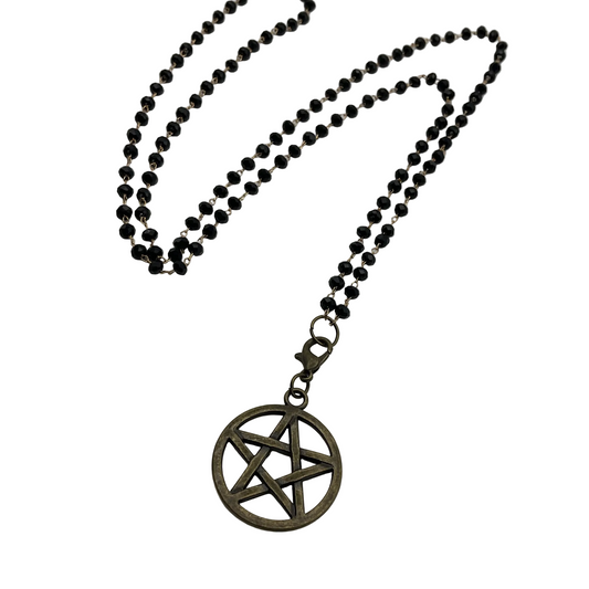 Dark Sparkle beads Necklace with a bronze tone pentacle pendant on a white background