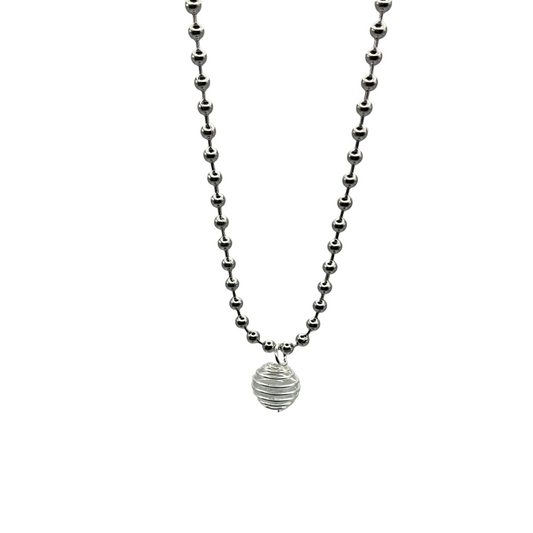 Silver tone ball chain necklace with a small round silver tone cage pendant containing a celestite crystal chip laying on a light gray background