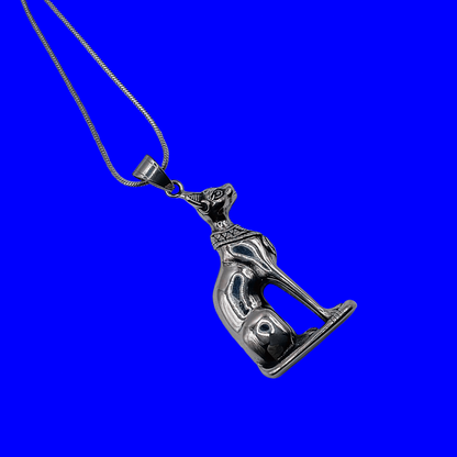 Silver Cat Bastet pendant on a blue background