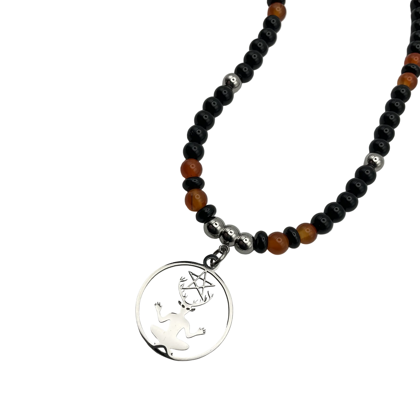 Necklace with black, orange, and silver beads and a silver Cernunnos pendant on a white background