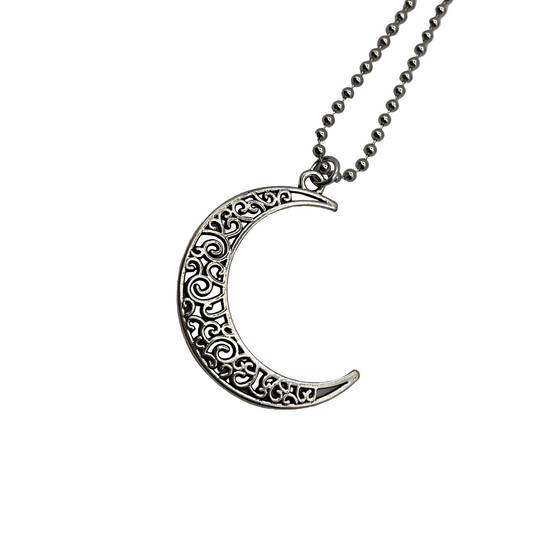 Silver tone crescent moon charm necklace on a white background