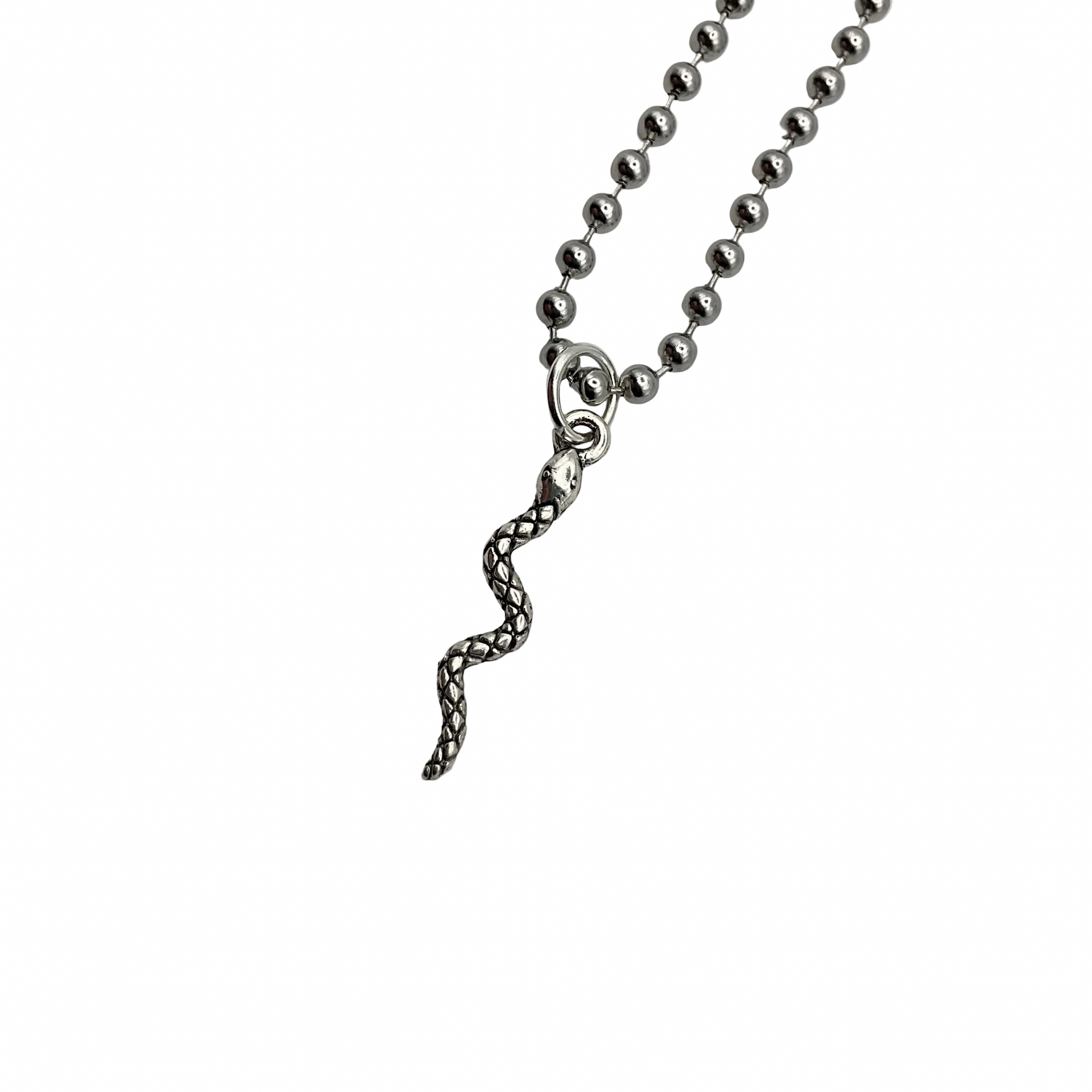Silver tone delicate snake pendant on a ball chain against a white background