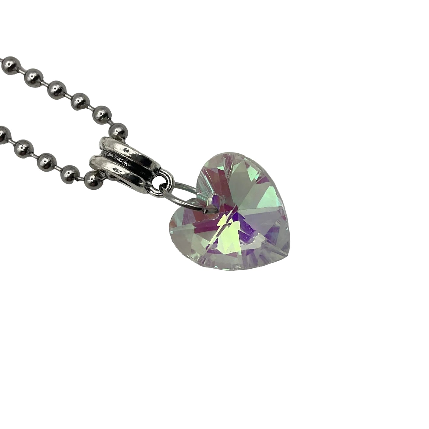 Heart-shaped crystal pendant on a ball chain against a white background