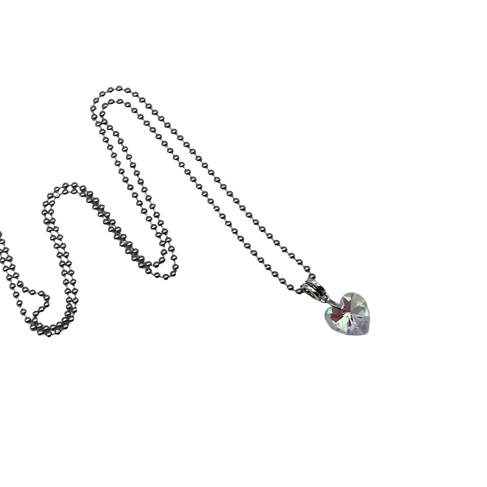 Ball chain charm Necklace with a sparkling crystal heart pendant on a white background