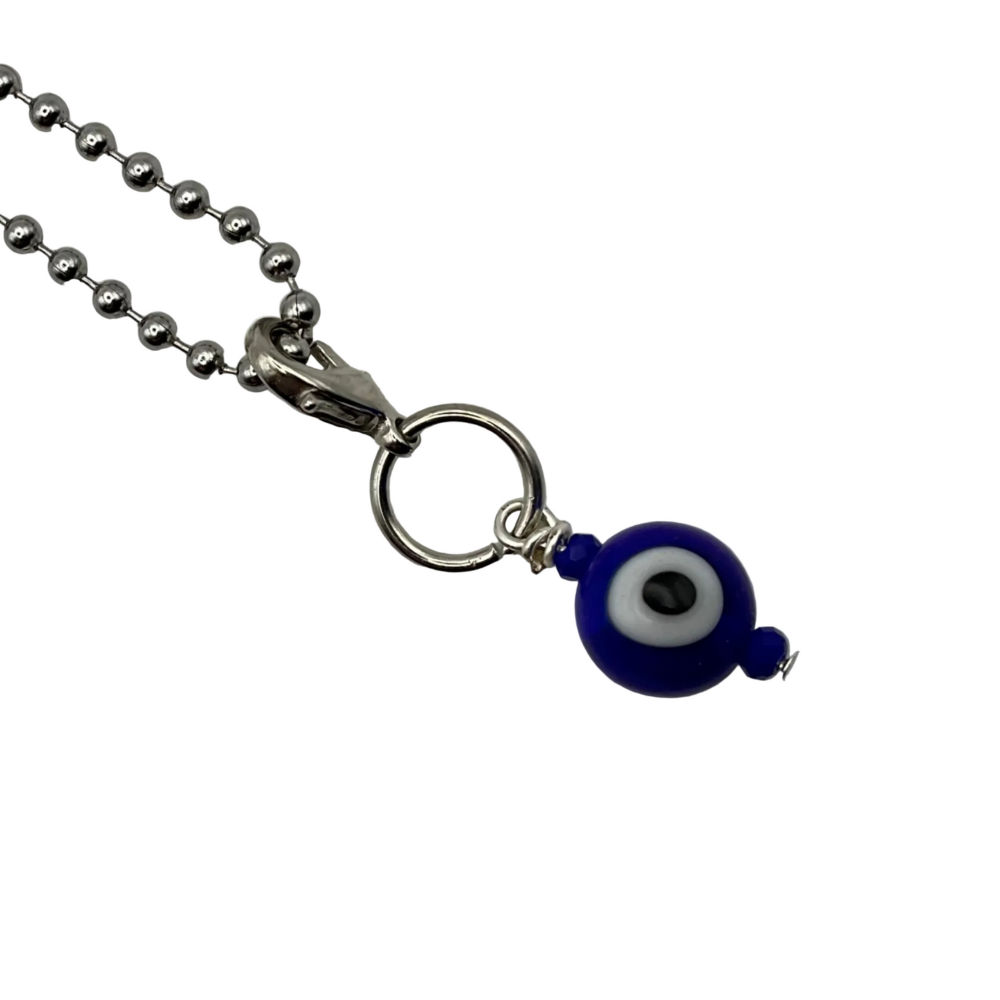 Blue glass evil eye bead charm on a ball chain against a white background