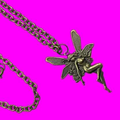 Bronze tone fairy pendant on a bronze tone chain displayed against a pink background