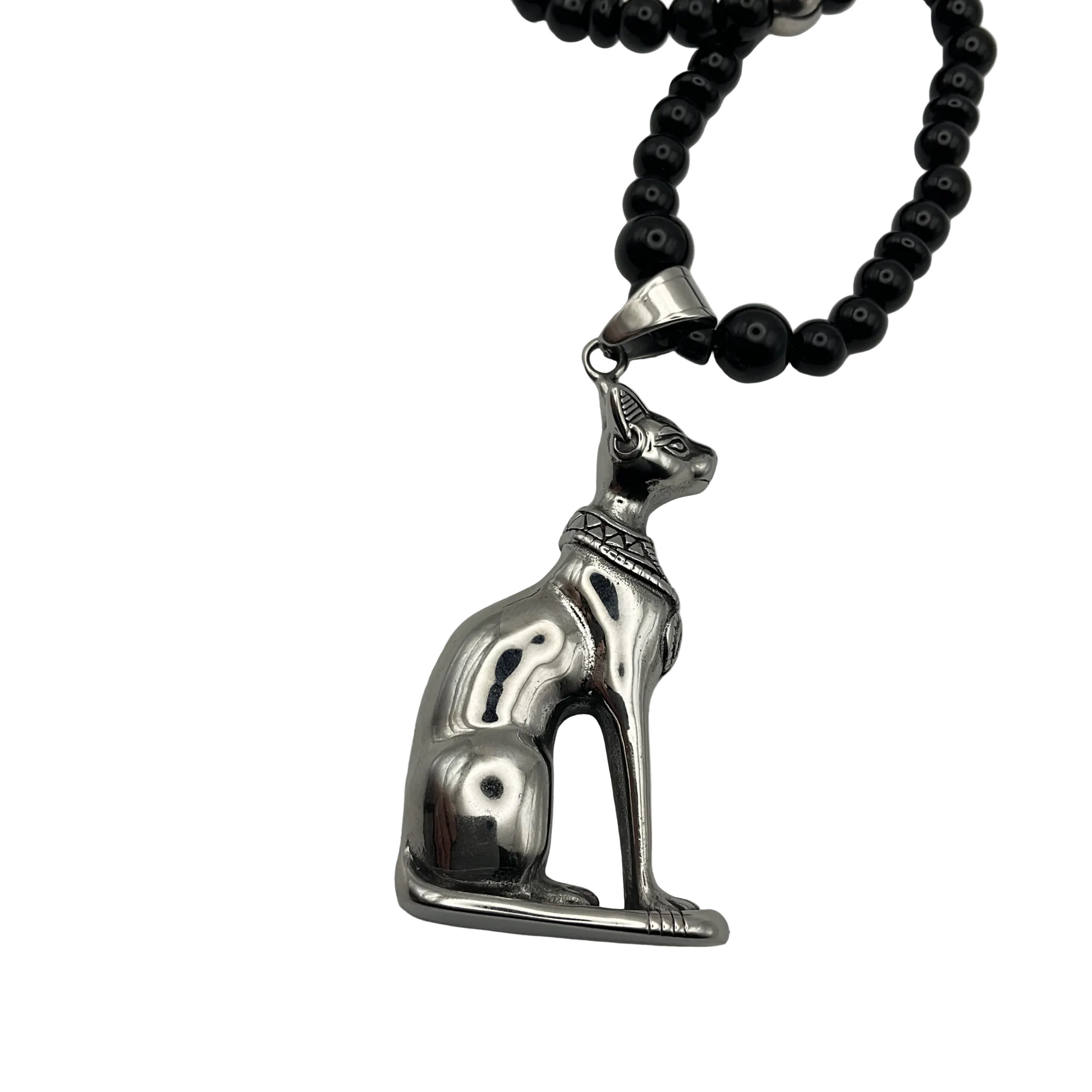 Silver tone cat pendant on a black beaded necklace with steel bead accents displayed  against a white background