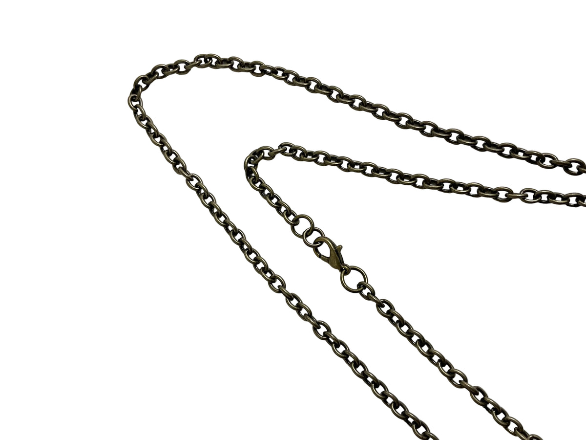 A dark metallic chain necklace with a lobster clasp, laid out on a plain white surface…showing the clasp