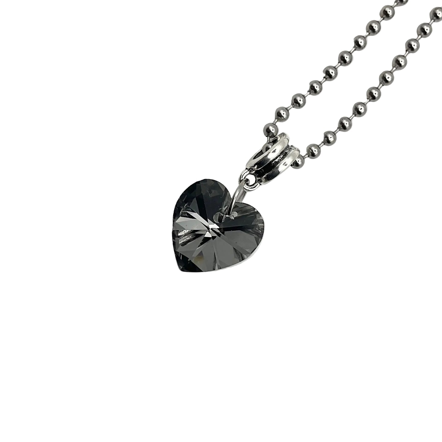 Sparkling Gray Heart-shaped crystal pendant on a ball chain chain against a white background