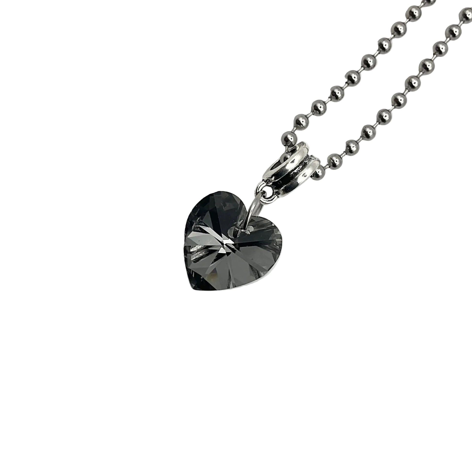 Sparkling Gray Heart-shaped crystal pendant on a ball chain chain against a white background