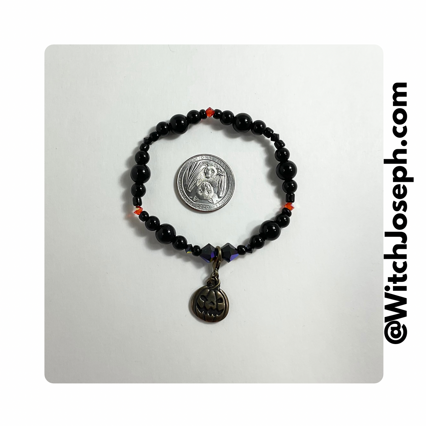 Halloween Stretch bracelet with jack o lantern displayed against a white background with the WItch Joseph url