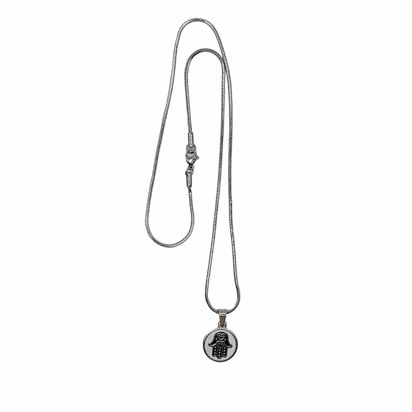 Silver tone necklace with a Hamsa hand pendant on a white background