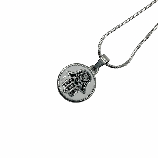 A Hamsa Hand talisman on stainless steel chain against a white background 