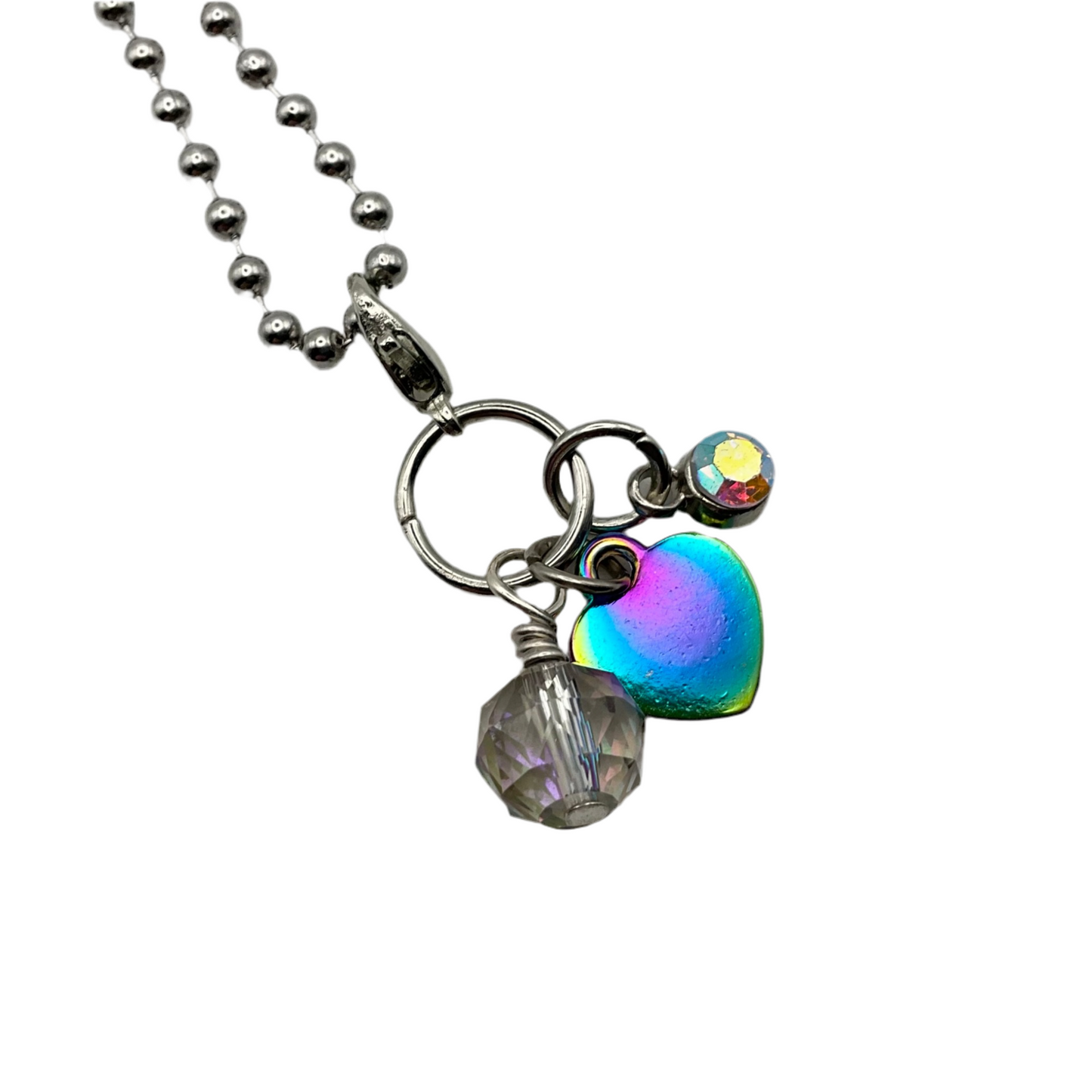 Necklace with heart-shaped and sparkling beaded charms on a white background