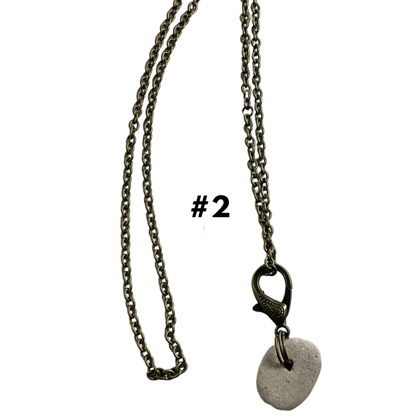 Bronze tone Necklace with a Holey Stone pendant on a white background