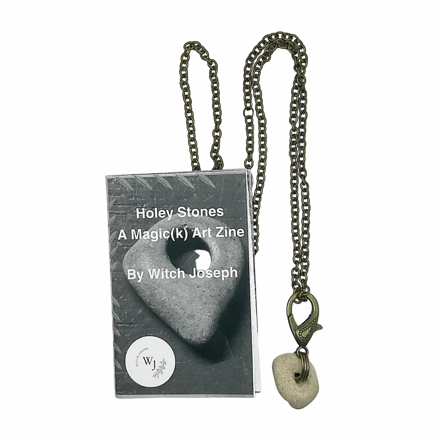 Bronze tone Necklace with Holey Stone pendant next to a zine titled 'Holey Stones' by Witch Joseph on a white background