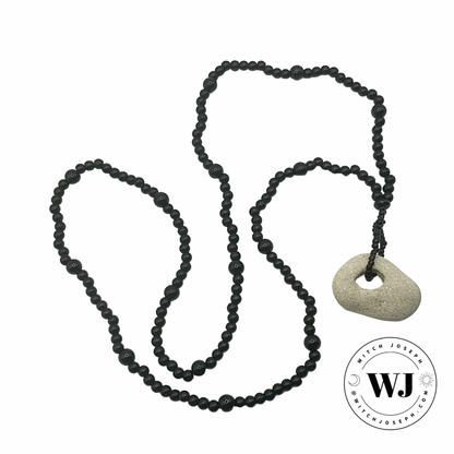 Black beaded necklace with a Holey stone pendant displayed on a white background, featuring the WJ logo.