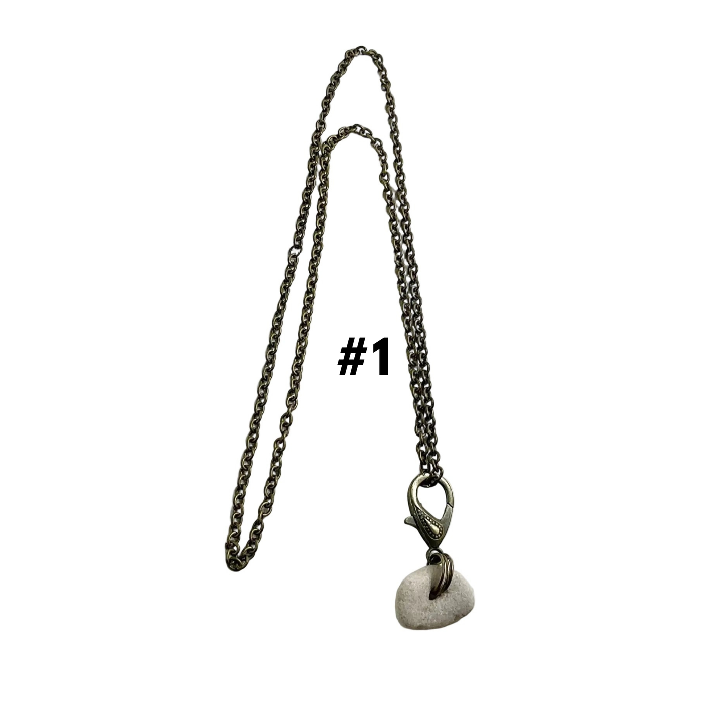Bronze tone Necklace with a Holey stone pendant on a white background