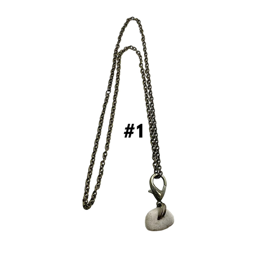 Bronze tone Necklace with a Holey stone pendant on a white background