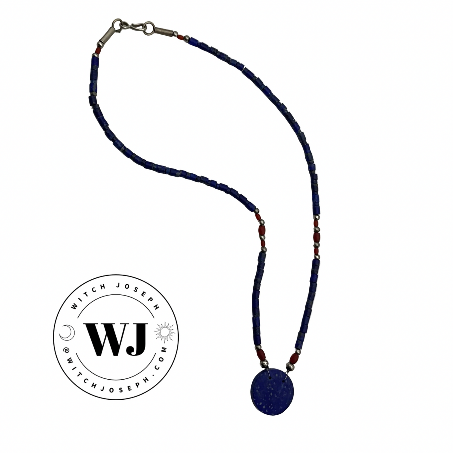 Lapis Lazuli blue beaded necklace, including red and silver tone accent beads,  with a round lapis pendant on a white background, featuring the brand 'Witch Joseph'.