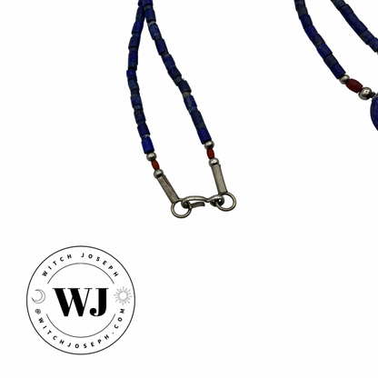 Necklace with Lapis Lazuli blue beads and showing the metal clasp displayed on a white background, featuring the WJ brand logo.