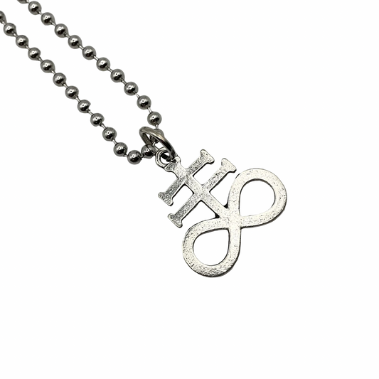 Silver Leviathan Cross pendant necklace on a silver ball chain on a white background
