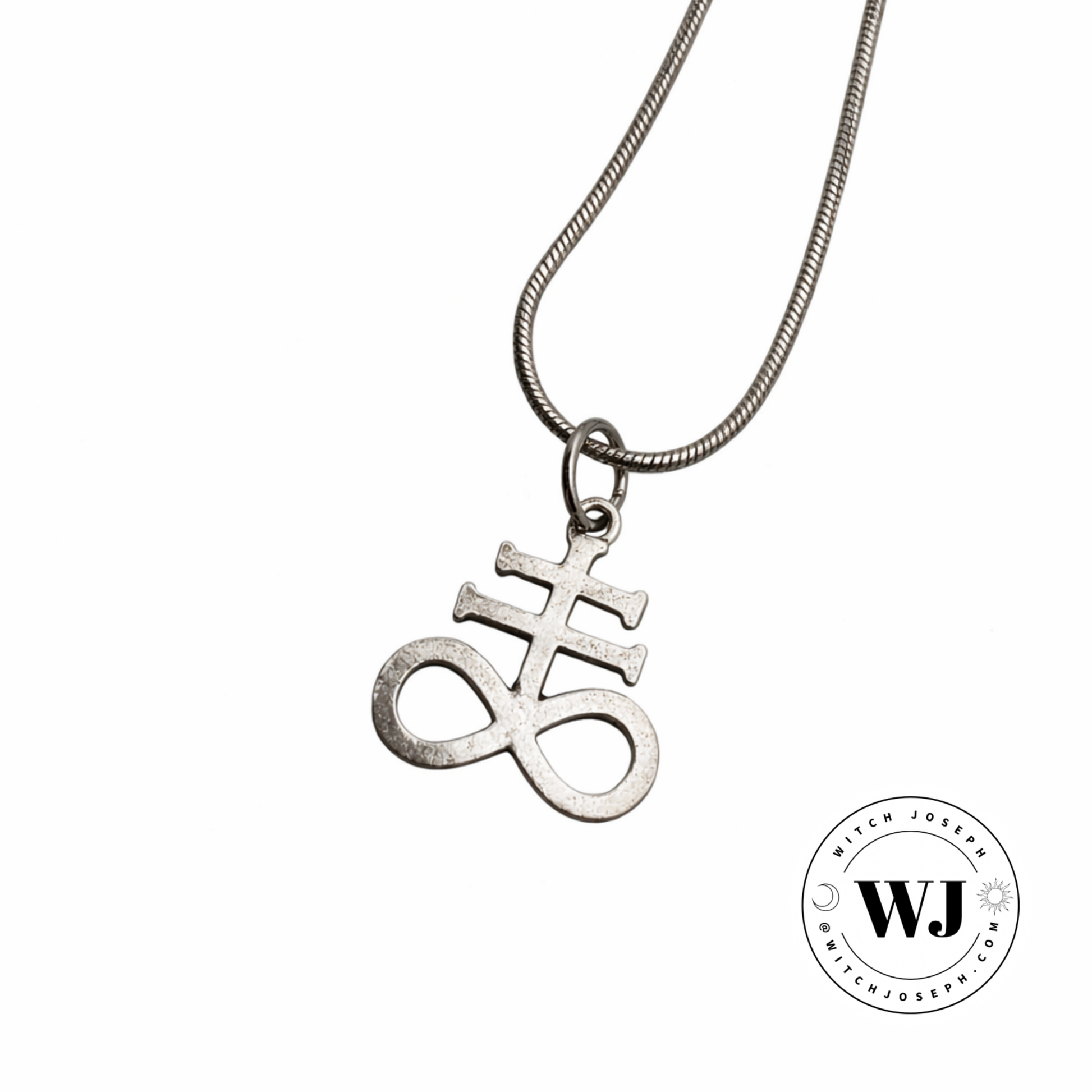 Silver tone necklace with a Leviathan cross pendant displayed on a white background, featuring the Witch Joseph logo