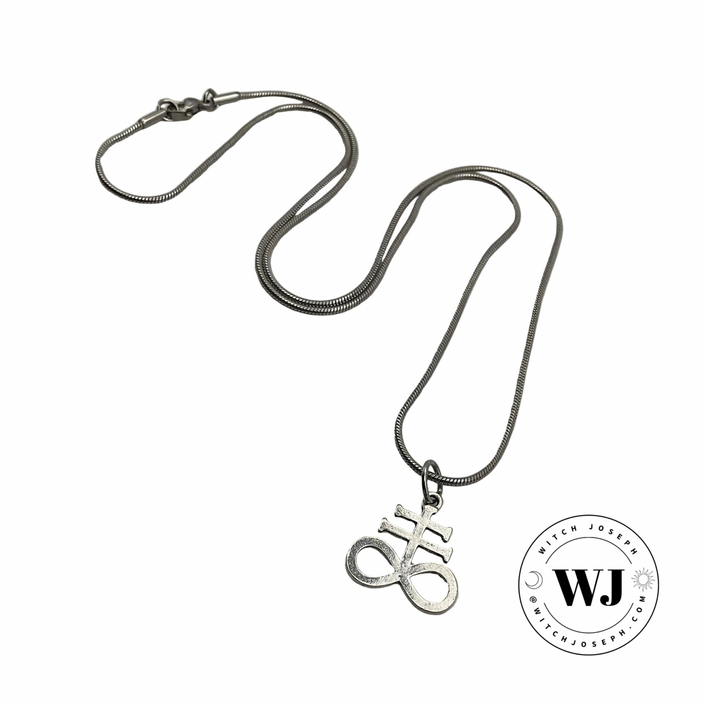 Silver tone necklace with a Leviathan Cross pendant on a white background, featuring the  Witch Joseph logo in the lower right corner of the photo