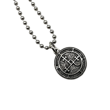 Silver ball chain charm necklace with a round silver tone Lilith seal pendant on a white background.
