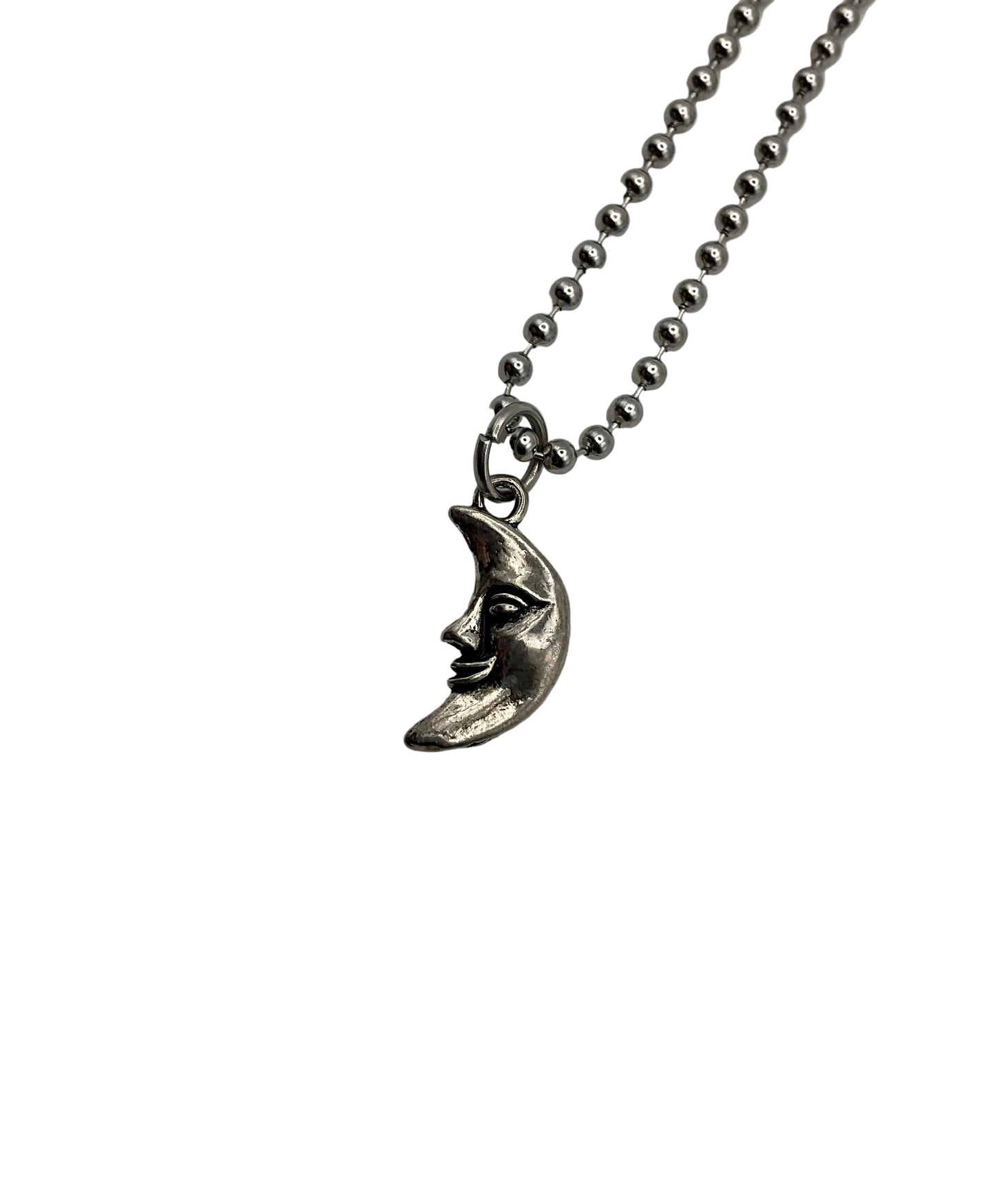 Silver tone necklace with a man in the moon face pendant on a silver tone ball chain on a white background