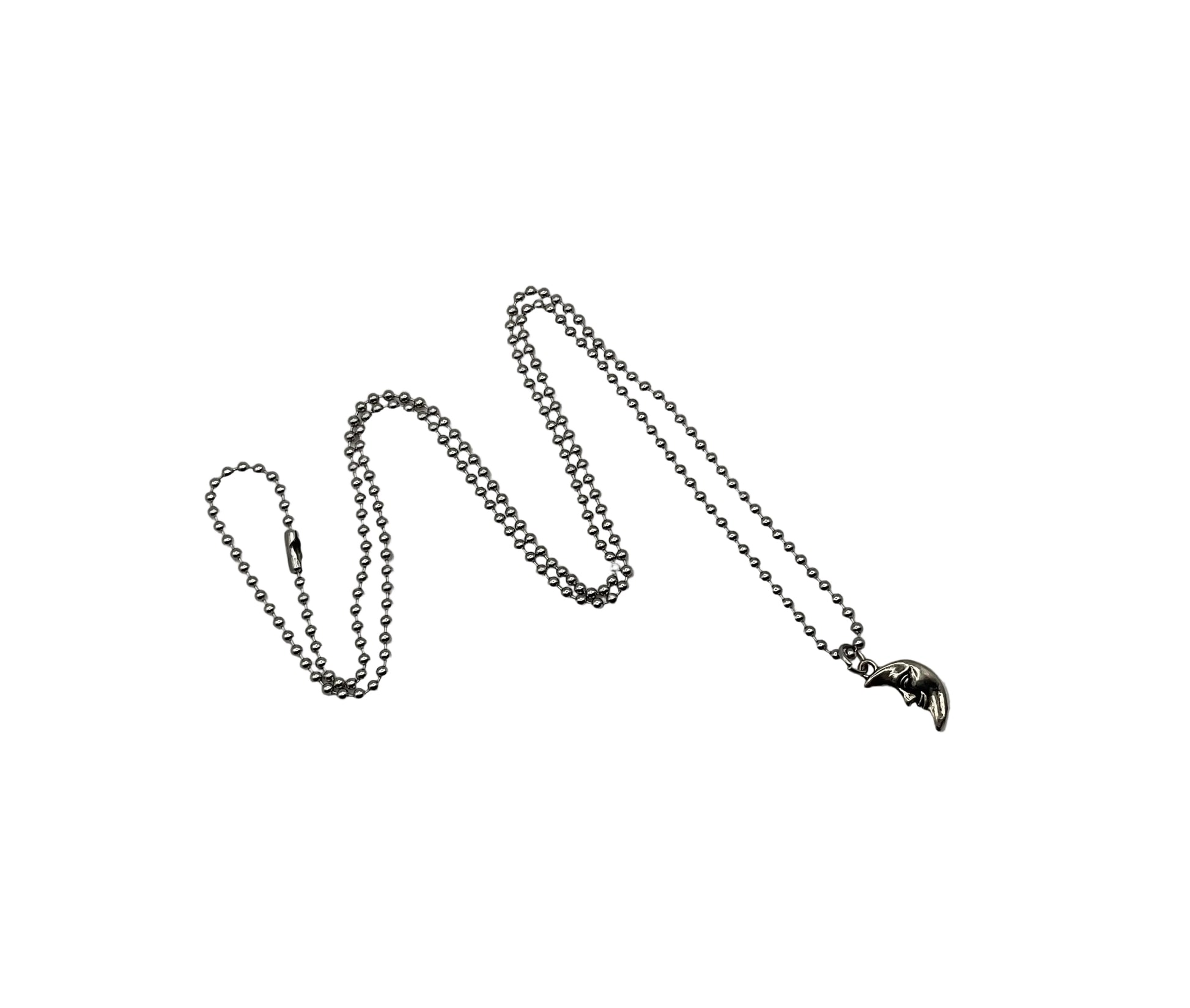 Silver tone chain necklace with a small man in the moon pendant on silver tone ball chain against a white background