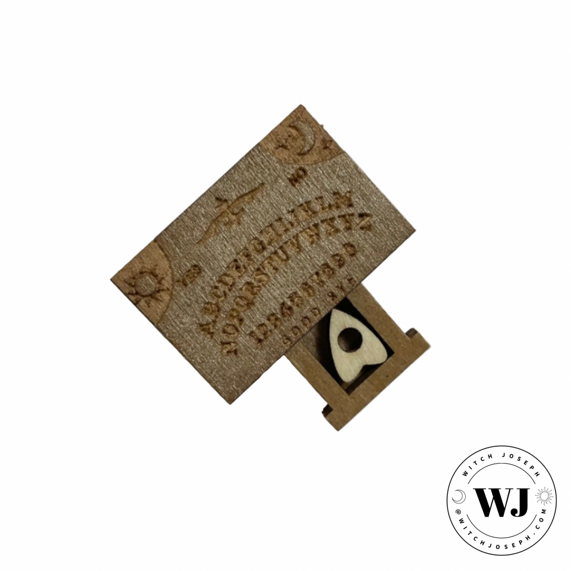 Mini Wooden Ouija with engraved designs and planchette in a drawer…displayed on a white background, featuring the brand 'WJ'.
