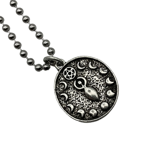 Silver tone Goddess disc pendant necklace with moon phases design on a white background