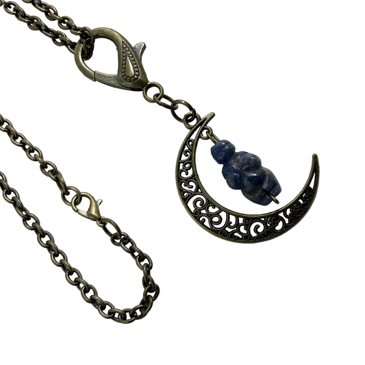 Bronze tone Necklace with a crescent moon pendant featuring a blue sodalite stone carved in a Goddess image displayed on a white background