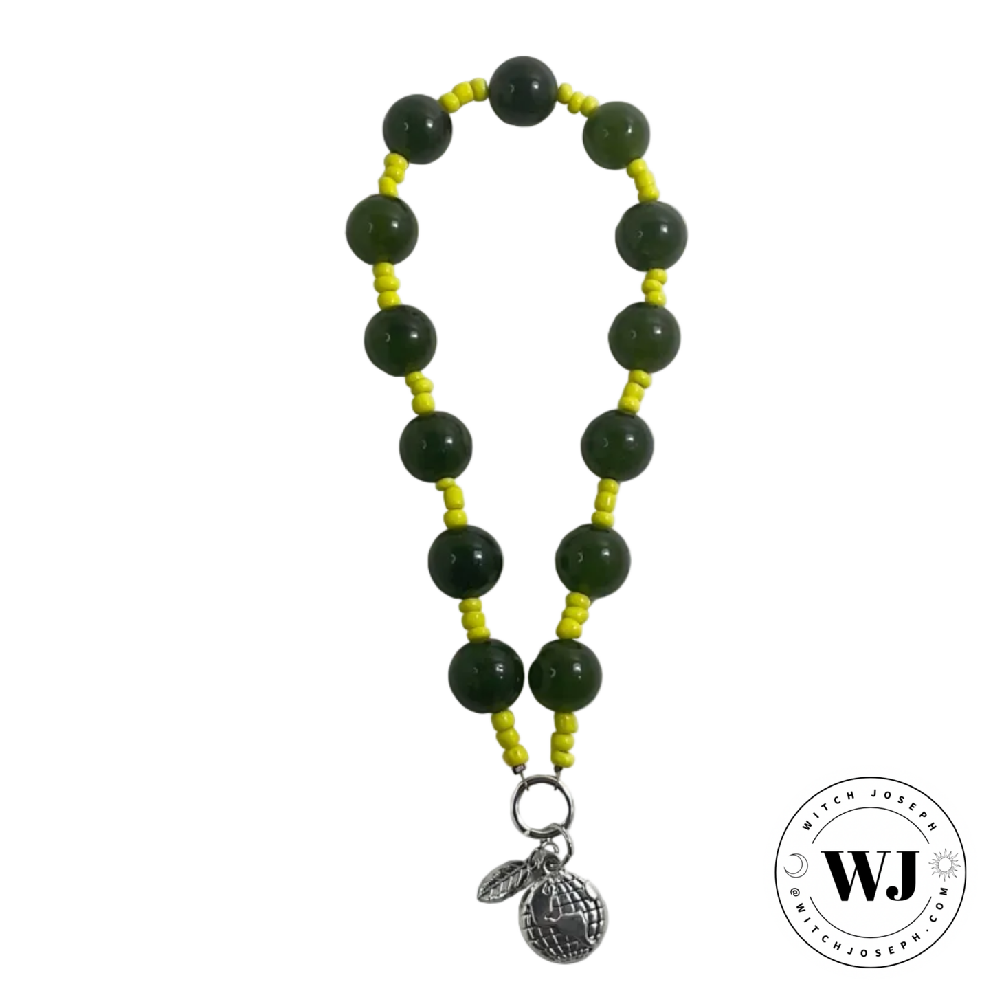 Beaded prayer beads with green and yellow beads and a silver earth charm and leaf charm…displayed on a white background, branded with 'WJ'.