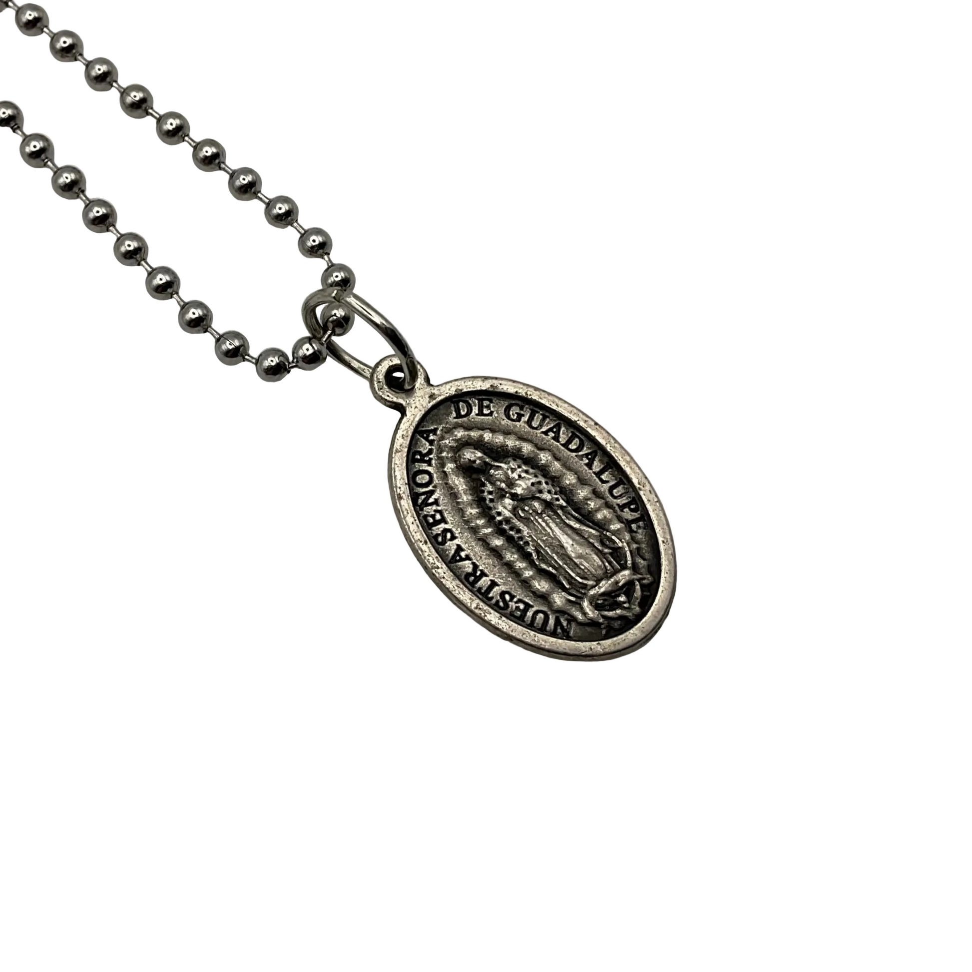 Silver tone ball chain necklace with an Italian Catholic Our Lady of Guadalupe image pendant, shown in this picture, and the Divine Mercy image on the reverse, on a white background