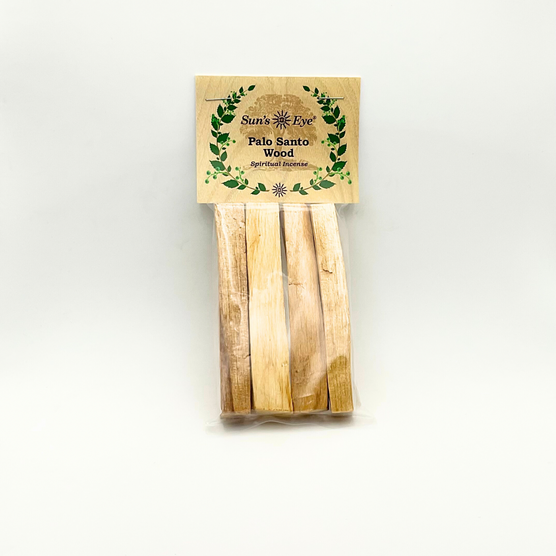 Four Palo Santo wood sticks in a package with a suns eye label on a white background