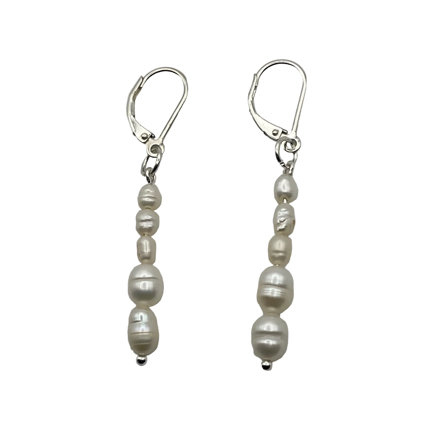 Pair of freshwater dangle pearl sterling silver earrings on a white background