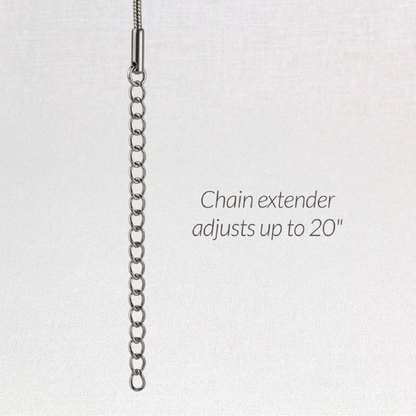 a photo of the pendulum love locket from suns eye showing the extender chain.