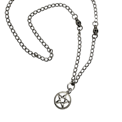 Silver tone chain necklace with a pentagram pendant with silver tone skull bead accents on a white background