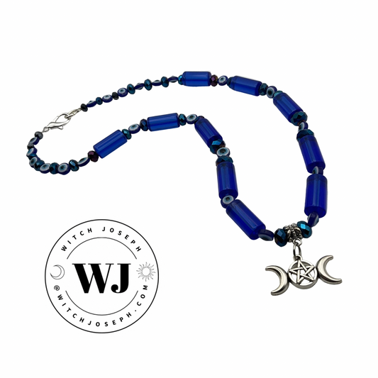 Blue beaded necklace with silver pentacle pendant on a white background, featuring the brand 'Witch Joseph'.