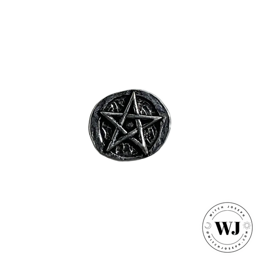 Metallic pentagram charm for carrying in pocket or purse displayed on a white background with 'WJ' logo.
