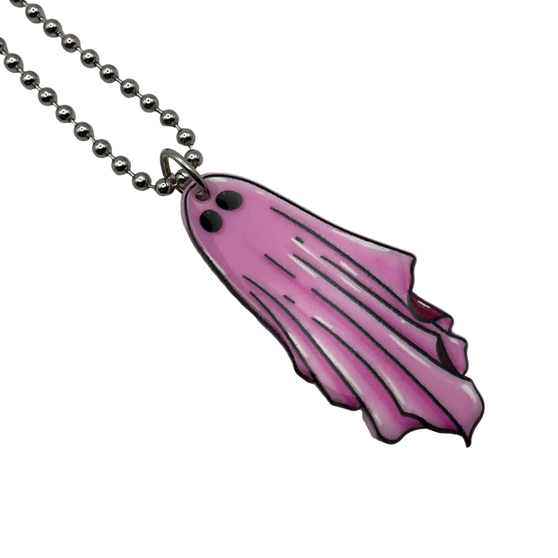 Pink ghost-shaped acrylic pendant on a ball chain against a white background
