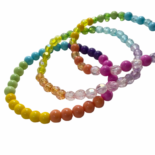 Set of 3 colorful pastel beaded bracelets displayed on a white background